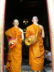 monks carrying water